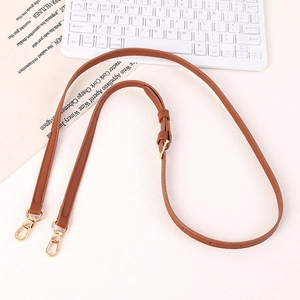 Adjustable brown lychee texture leather strap with gold metal buckles and fine stitching