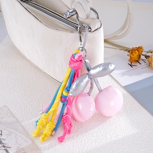 Pink handmade woven nylon rope cherry bag charm with silver leaf and metallic buckle