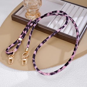 Detail of pink leopard print plush strap with luxury gold metal lobster clasps