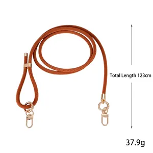 Adjustable brown leather crossbody strap with gold metal buckles, total length 123cm