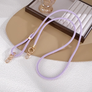 Close-up of purple leather phone lanyard with adjustable gold metal lobster clasps