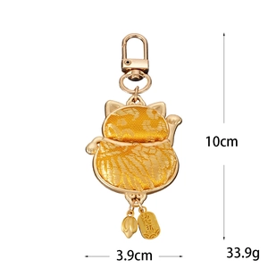 Golden embroidery Maneki Neko lucky cat keychain with traditional charm and metal hook
