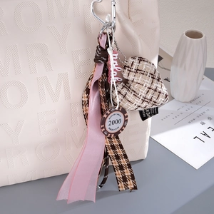 Chic houndstooth heart bag charm with pink ribbon and vintage poker club tag accessory