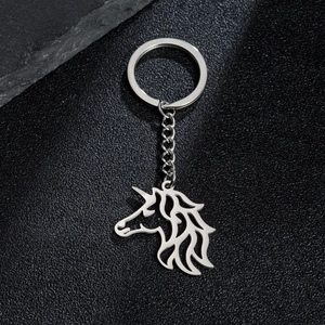 Close-up of hollow unicorn charm pendant keychain made of polished stainless steel