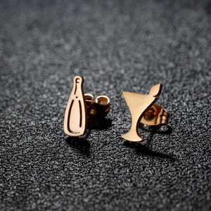 Asymmetric gold wine bottle and cocktail glass stud earrings with high polish finish