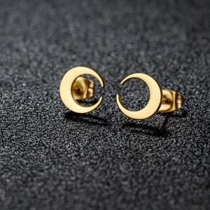 Minimalist gold crescent moon stud earrings with polished finish and butterfly backs