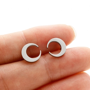 Detailed close-up of crescent moon stud earrings in polished silver stainless steel
