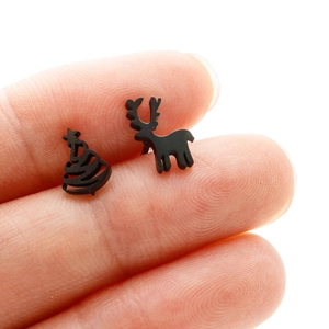 Close-up of matte black stainless steel Christmas tree and reindeer stud earrings