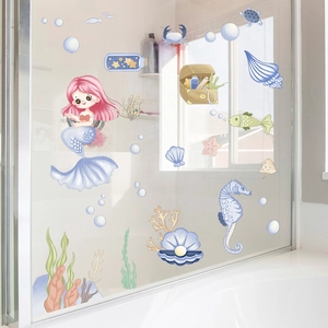 Detail of waterproof mermaid wall decals with sea animals on a glass bathroom partition
