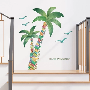 Detail of The Tree of Knowledge wall decal with books coconut trees and seagulls