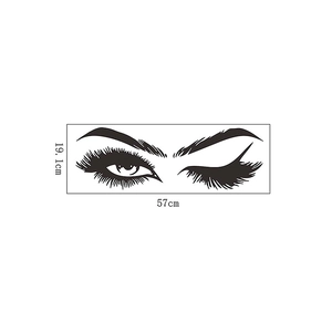 Detail view of stylish eyelashes wall decal showing dimensions of 57cm by 19.1cm in black