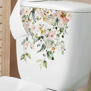 Tropical watercolor floral wall decal with green leaves and pink flowers on white ceramic
