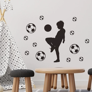 Soccer wall sticker featuring boy silhouette and 12 black and white football decals