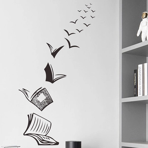 Creative black wall sticker featuring books transforming into flying birds for home decor