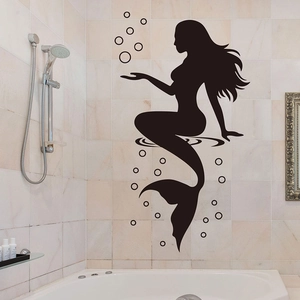 Elegant black mermaid silhouette wall decal with bubbles on beige bathroom tiles