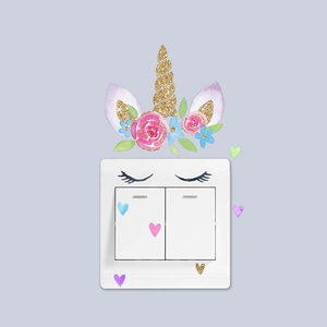 Unicorn themed wall decal set with gold glitter horn and floral leaves for light switches