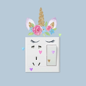 Unicorn themed light switch wall sticker with gold glitter horn and pink floral accents