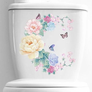 Floral butterfly toilet stickers featuring yellow pink peonies on white ceramic tank