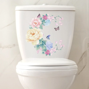 Watercolor flower and butterfly self-adhesive wall stickers on a white ceramic toilet tank