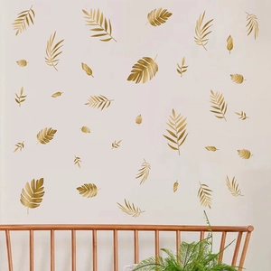 Golden tropical leaf wall stickers set featuring palm and monstera for home decor