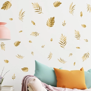Golden tropical leaf wall stickers featuring palm leaf designs for Nordic living room decor