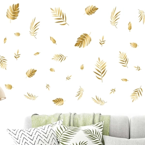 Golden tropical leaf wall stickers featuring palm and fern designs for living room decor