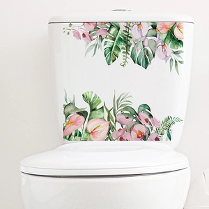 Watercolour tropical flowers and leaves sticker applied on white toilet tank