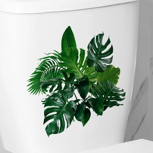Tropical monstera leaf wall sticker for bathroom decoration on white toilet tank