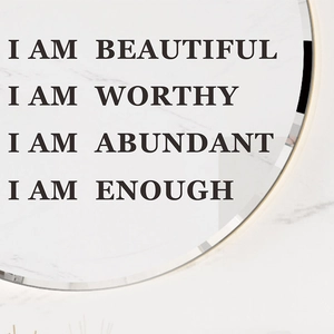 Detail view of inspirational wall sticker with I AM BEAUTIFUL affirmations on marble