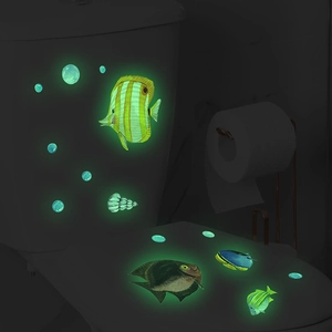 Glow in the dark ocean fish wall stickers showing luminous effect on toilet in the dark