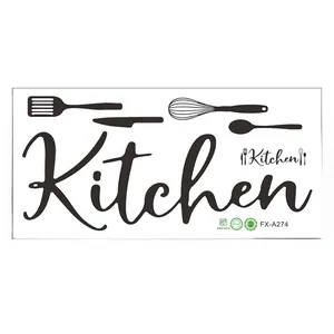 Close-up of black PVC kitchen wall sticker with utensils icons and cursive lettering