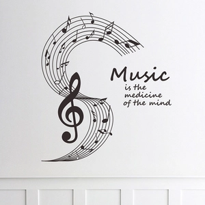 Black vinyl music wall decal featuring treble clef notes and mind medicine quote