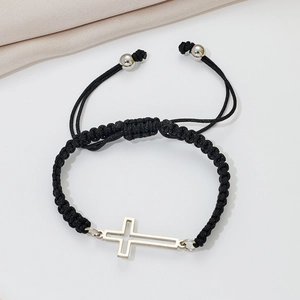 Detail showing the adjustable black braided rope and hollow stainless steel cross charm