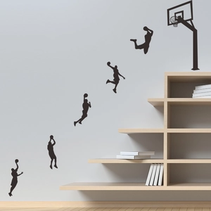 Detail of 6-piece black vinyl basketball slam dunk silhouette wall decals on a grey wall