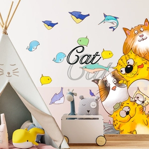 Cartoon cats and colorful fish wall decals for kids' room decoration in a cozy bedroom