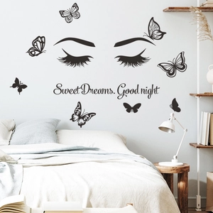 Detail showing Sweet Dreams Good Night wall stickers with butterflies over the bed