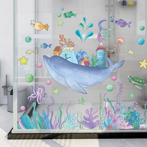 Detail view of cartoon whale and ocean animal wall stickers on a glass shower door