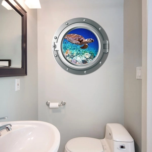 Porthole wall sticker with sea turtle and tropical fish in a modern bathroom setup