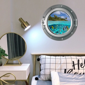 Detail of round ship porthole wall sticker featuring tropical beach and underwater fish