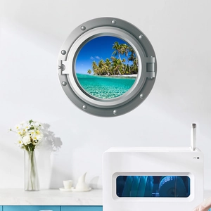 Detail of 3D porthole wall sticker with tropical beach and palm trees in a kitchen