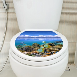 Detailed application of underwater coral reef sticker on white toilet lid cover