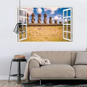 3D wall sticker featuring Moai statues viewed through a faux window over a sofa