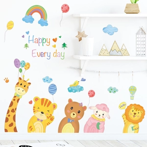 Detailed view of cartoon animals and rainbow wall decals in a warm Macaron color palette
