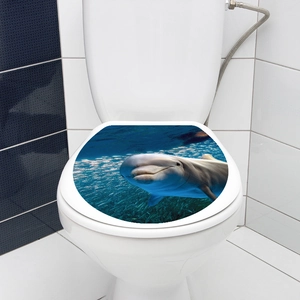 Detailed view of 3D marine dolphin waterproof PVC sticker applied on a toilet lid