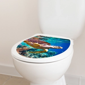 Detail of sea turtle toilet lid decal featuring a vibrant coral reef ocean pattern