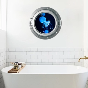 Detail of nautical porthole wall decal with bioluminescent jellyfish in a bathroom setting