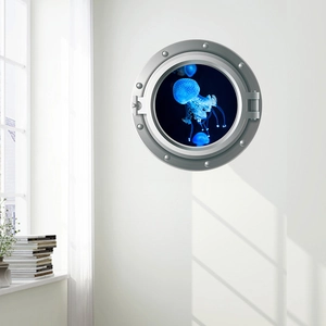 Detail view of 3D porthole wall sticker featuring a glowing blue jellyfish in a silver frame