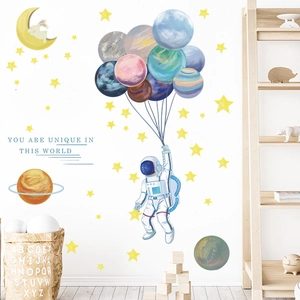 Detailed view of astronaut and space wall stickers with colorful planets and moon decor