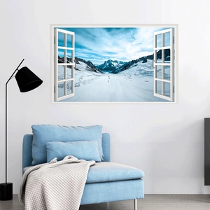 Detail of 3D window wall sticker showing a snowy mountain view over a blue sofa
