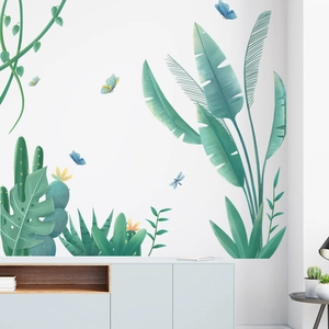 Detail von tropischen Pflanzen-Wandstickern mit Bananenblättern und Kaktus auf weißer Wand
